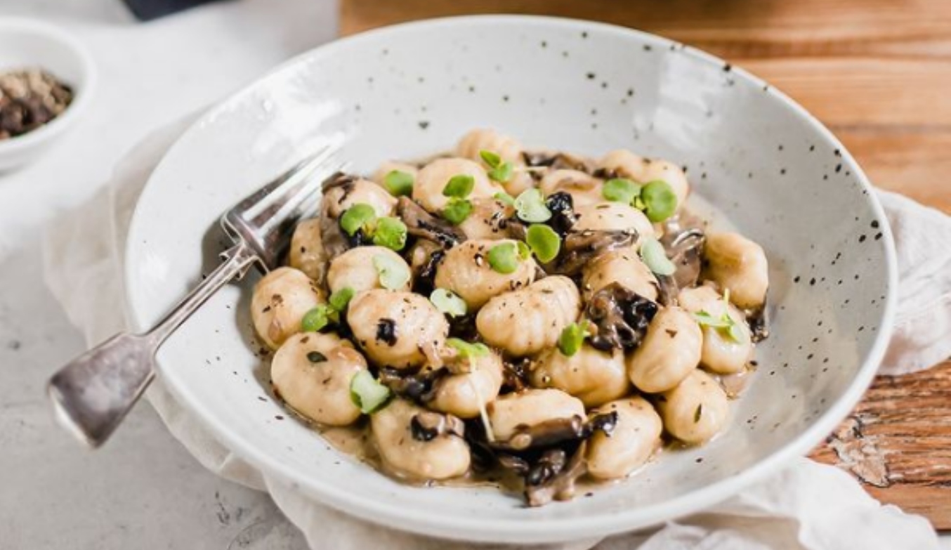 Truffle gnocchi on a plate with a fork